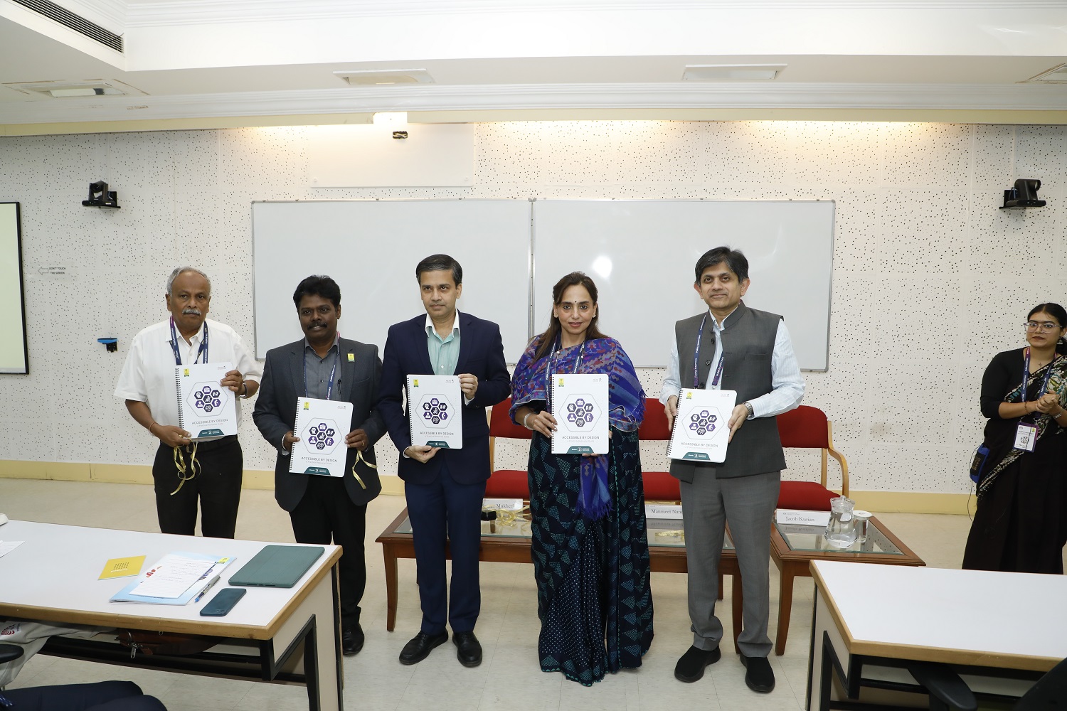 (L-R): Group photograph from the launch of the Resource Book on Accessibility in Educational Institutions at Purple Manthan featuring P. K. Gopalakrishnan, APD member, N. S. Senthil Kumar, CEO, APD, Prof. Sourav Mukherji, Dean, Faculty, IIMB, Mrs. Manmeet Nanda, Additional Secretary, DEPwD, Ministry of Social Justice and Empowerment, and Prof. Anil B Suraj, Chairperson, Diversity & Inclusion Committee, and NSR Pre-doc, IIMB.