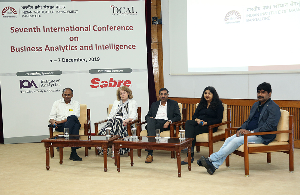 Mahesh Calavai, Chief Data & Analytics Officer at TVS Motor Group, Teresa Jacobs, Executive Director at ISDC, Maneesh Bhandari, Global Analytics leader at IBM, and Payeli Ghosh, Founder & Partner at Jiffy, shared their views on ‘AI First – Opportunities and Challenges’ in a panel discussion moderated by Prof. U. Dinesh Kumar, Chair, Data Centre and Analytics Lab (DCAL) at IIM Bangalore, during the 7th International Conference on Business Analytics and Intelligence at IIMB on December 06, 2019.