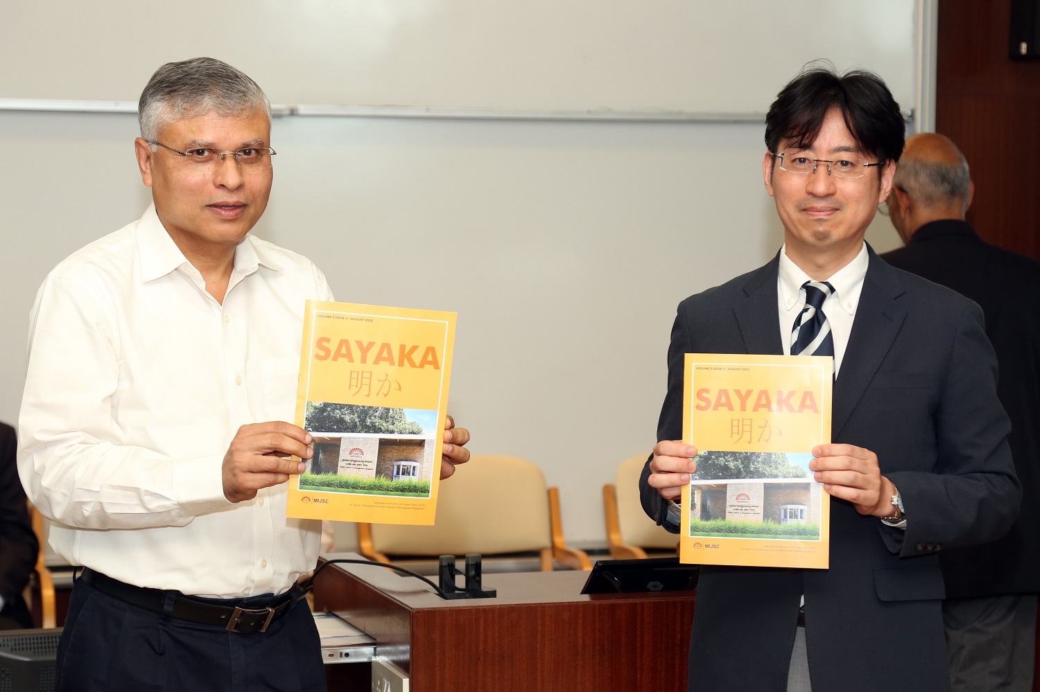 Prof. D Krishna Sundar, Chairperson, Mizuho India-Japan Study Centre and Toshihiro Mizutani, Director General of JETRO, declare a volume of the MIJSC newsletter officially open.