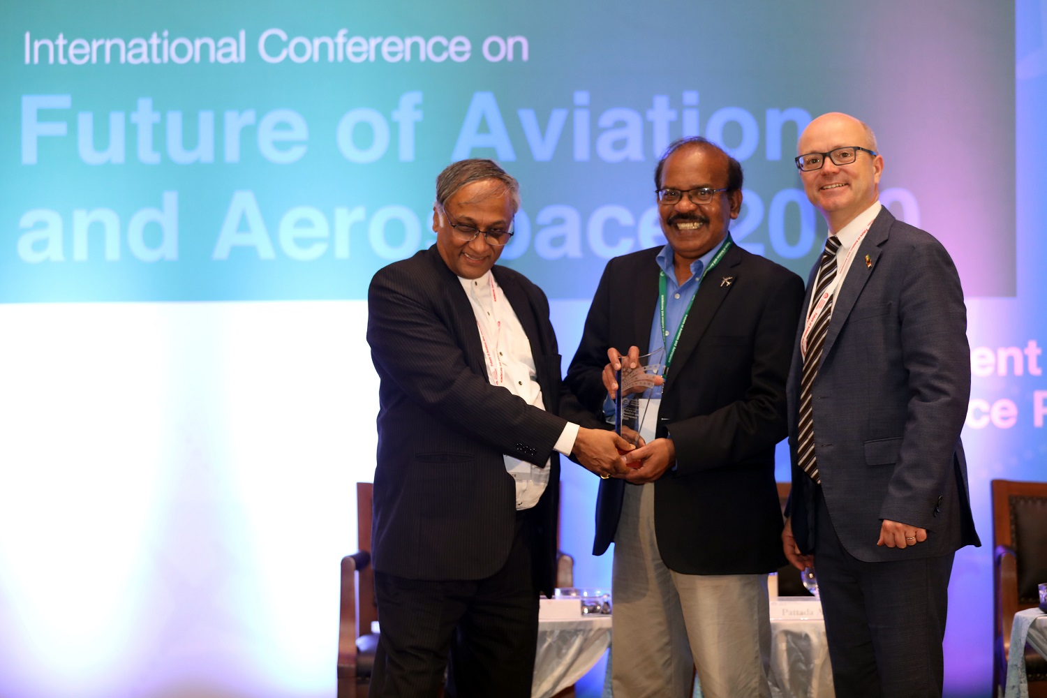 Madan Mohan Raj, Chief Programme Officer, Executive Education Programmes, IIM Bangalore, is felicitated for organizing the Future of Aviation & Aerospace Conference with this team, by Programme Directors of the GMAE Professors S Raghunath, IIM Bangalore, and Christophe Benroye, TBS, France.