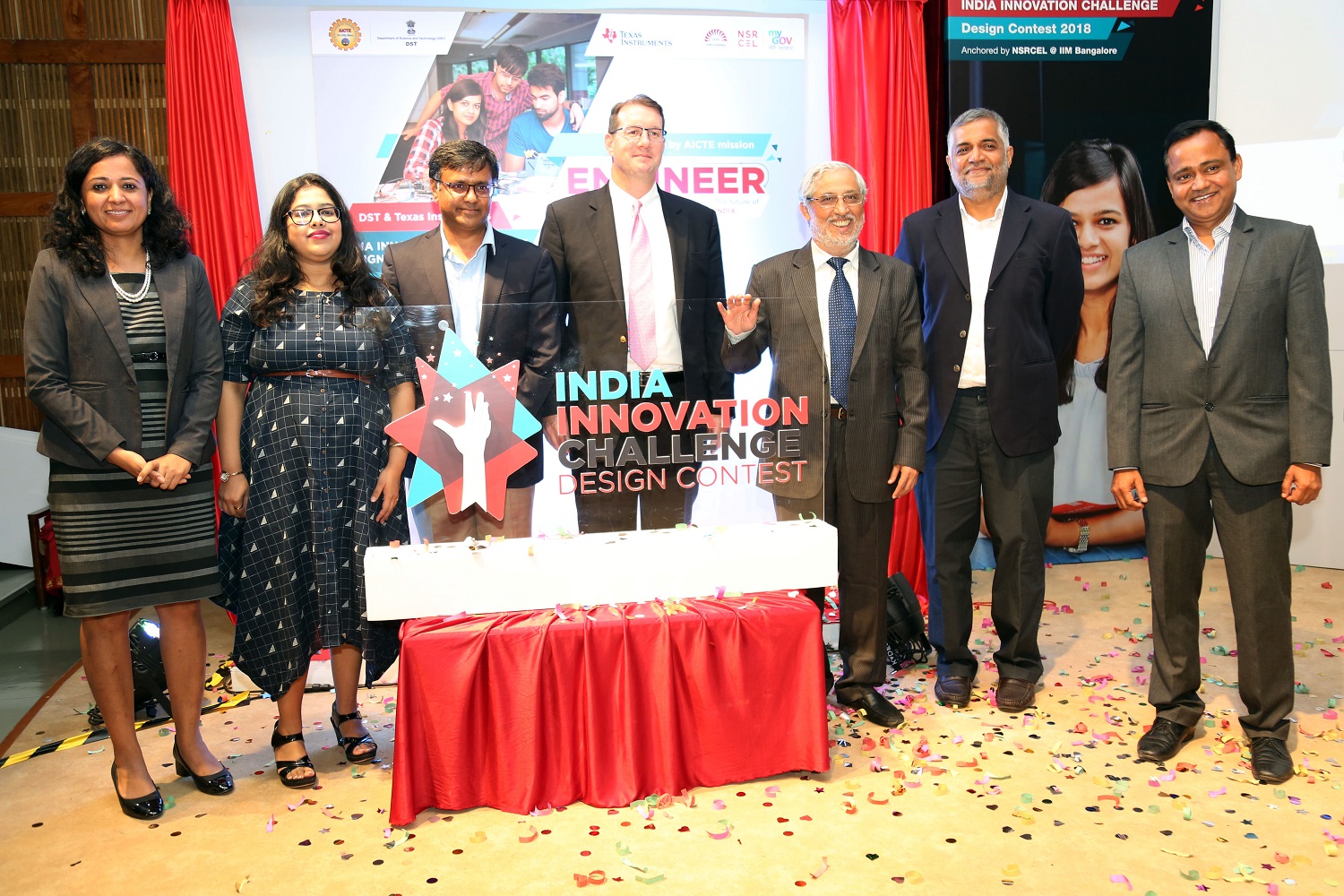 Prof. Venkatesh Panchapagesan, Chair, NSRCEL at IIM Bangalore, and guests from Texas Instruments, unveil the logo for IICDC 2019.